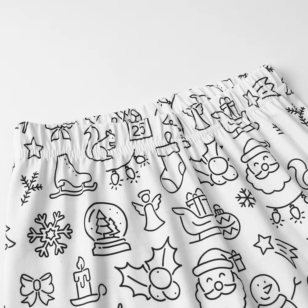 Close-up of The Coloring Pajama's Holiday print waistband, ready to color with Santa, stockings, and snowflakes