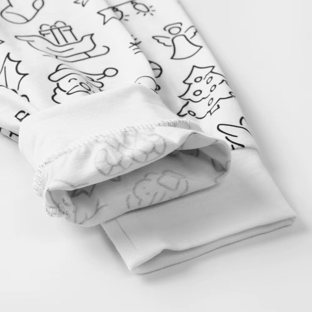 Folded cuff of The Coloring Pajama Holiday print pants, showing the uncolored design